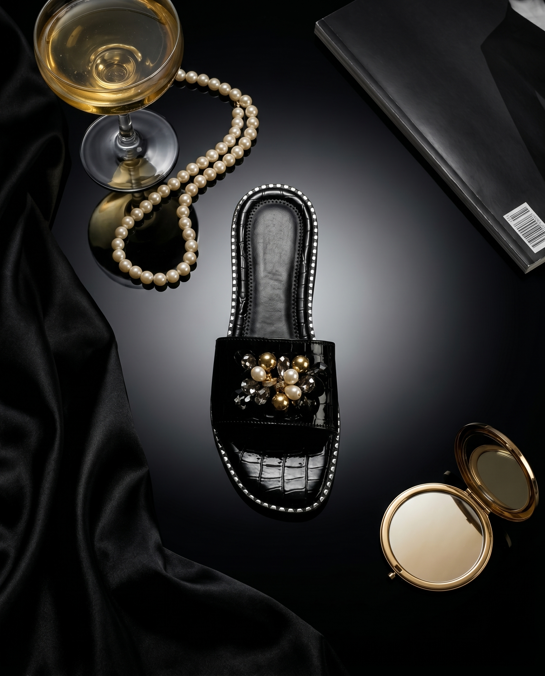 Topaz Black Flat Sliders top view with pearl necklace and champagne coupe — black patent croc flat sliders with gold bead and pearl floral brooch by Solemates by Palak
