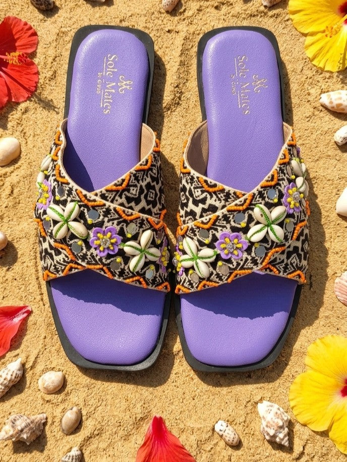 Malibu Criss Cross Flat Sliders top view on sand — tribal ikat print with cowrie shells and purple flowers by 
Solemates by Palak