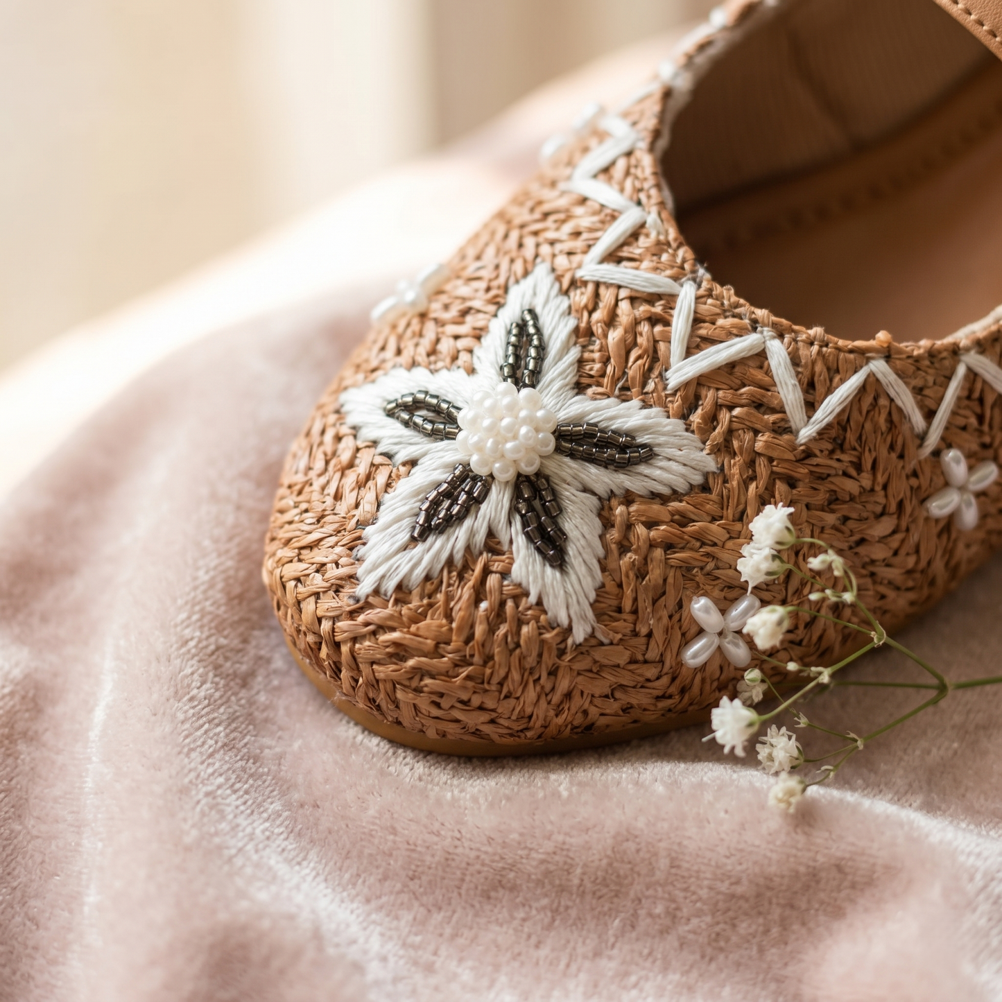 Retro Royal Mary Jane Flats close-up — white thread daisy with dark seed bead petals and pearl centre cluster on camel raffia by Solemates by Palak