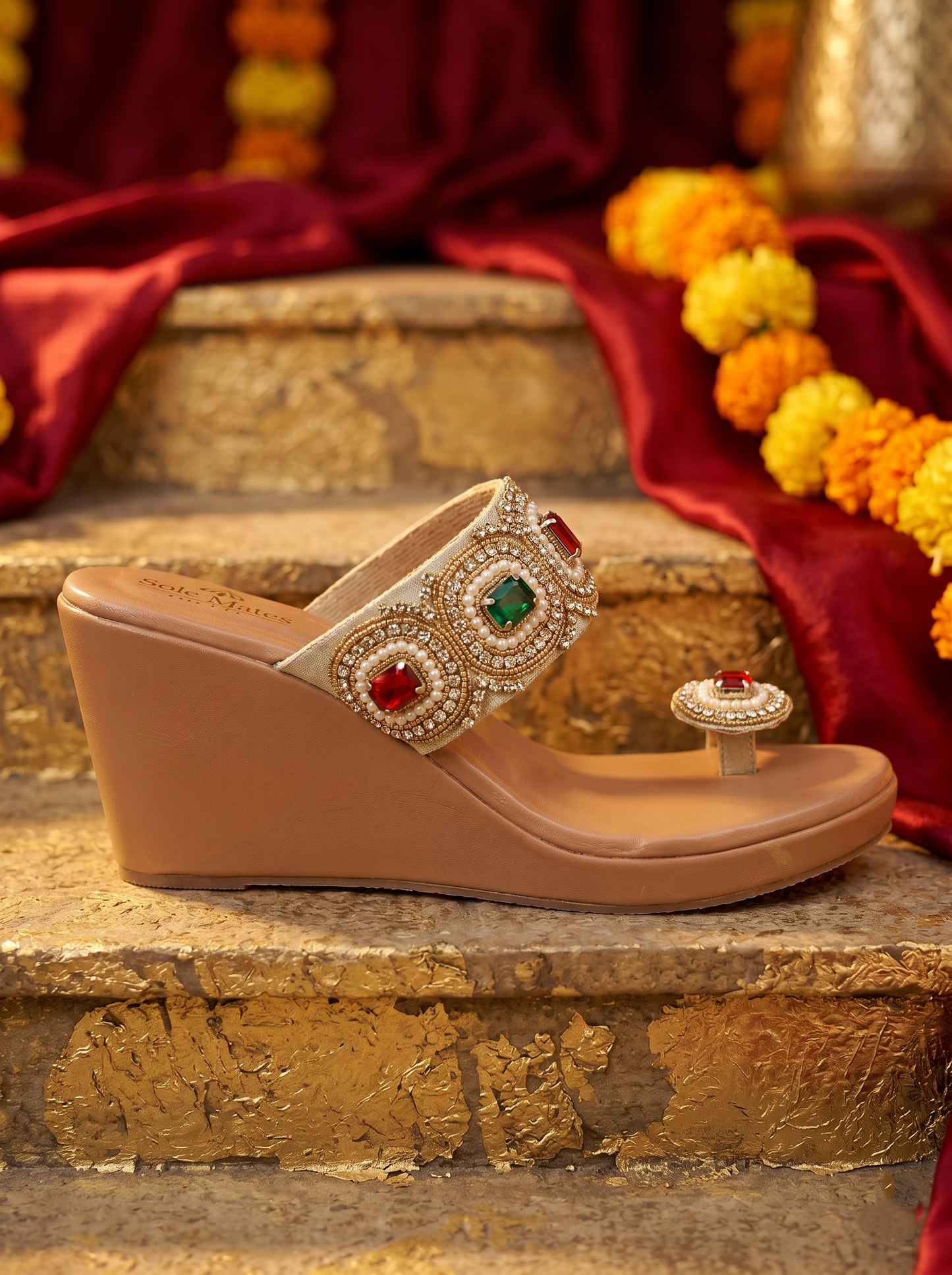 Rang Manch Kolhapuri Heels side profile on stone steps — cream strap with ruby and emerald stone circular motifs and pearl bead detailing by Solemates by Palak